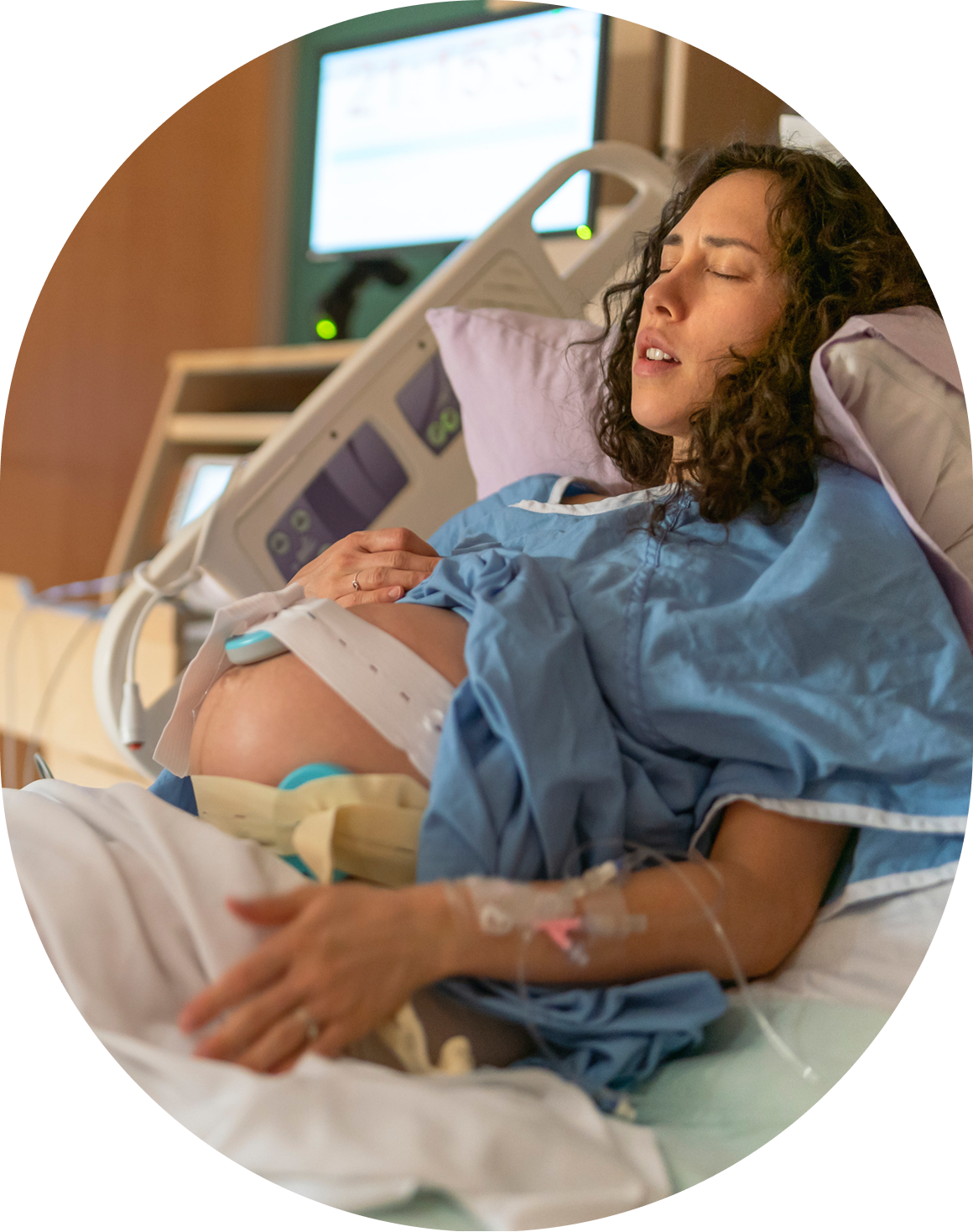 Expectant mother in hospital bed