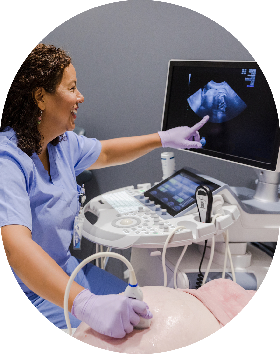 Ultrasound technician examining a patient's scan.