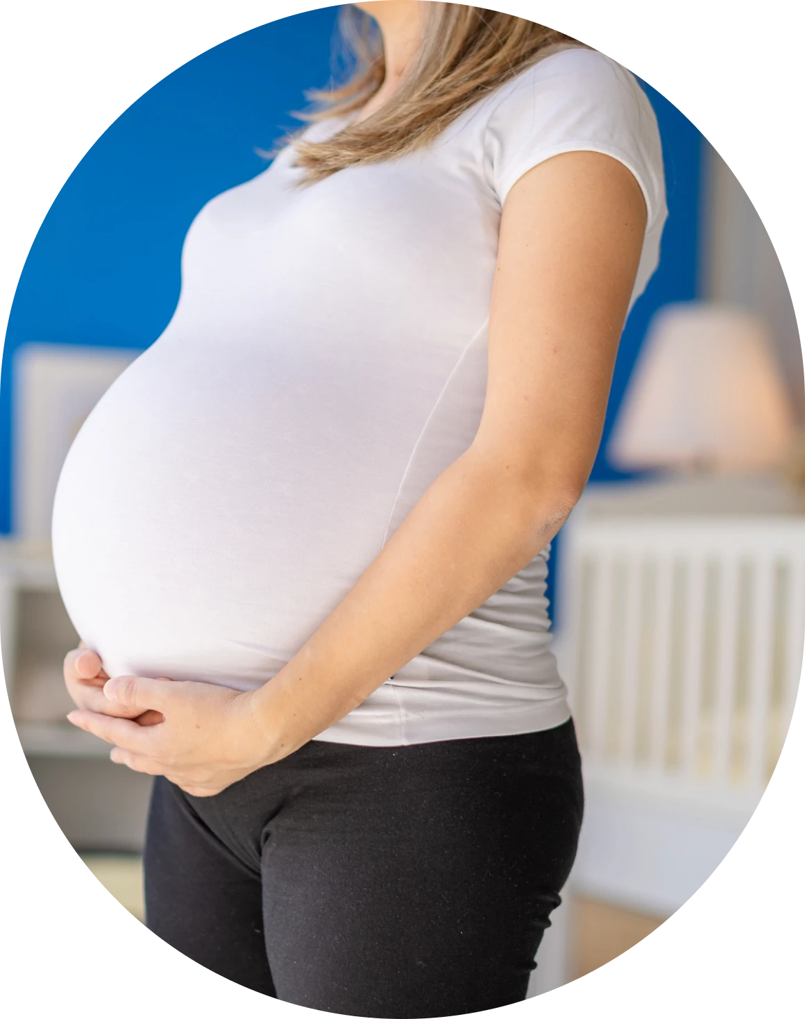 Expectant mother in white shirt, black pants